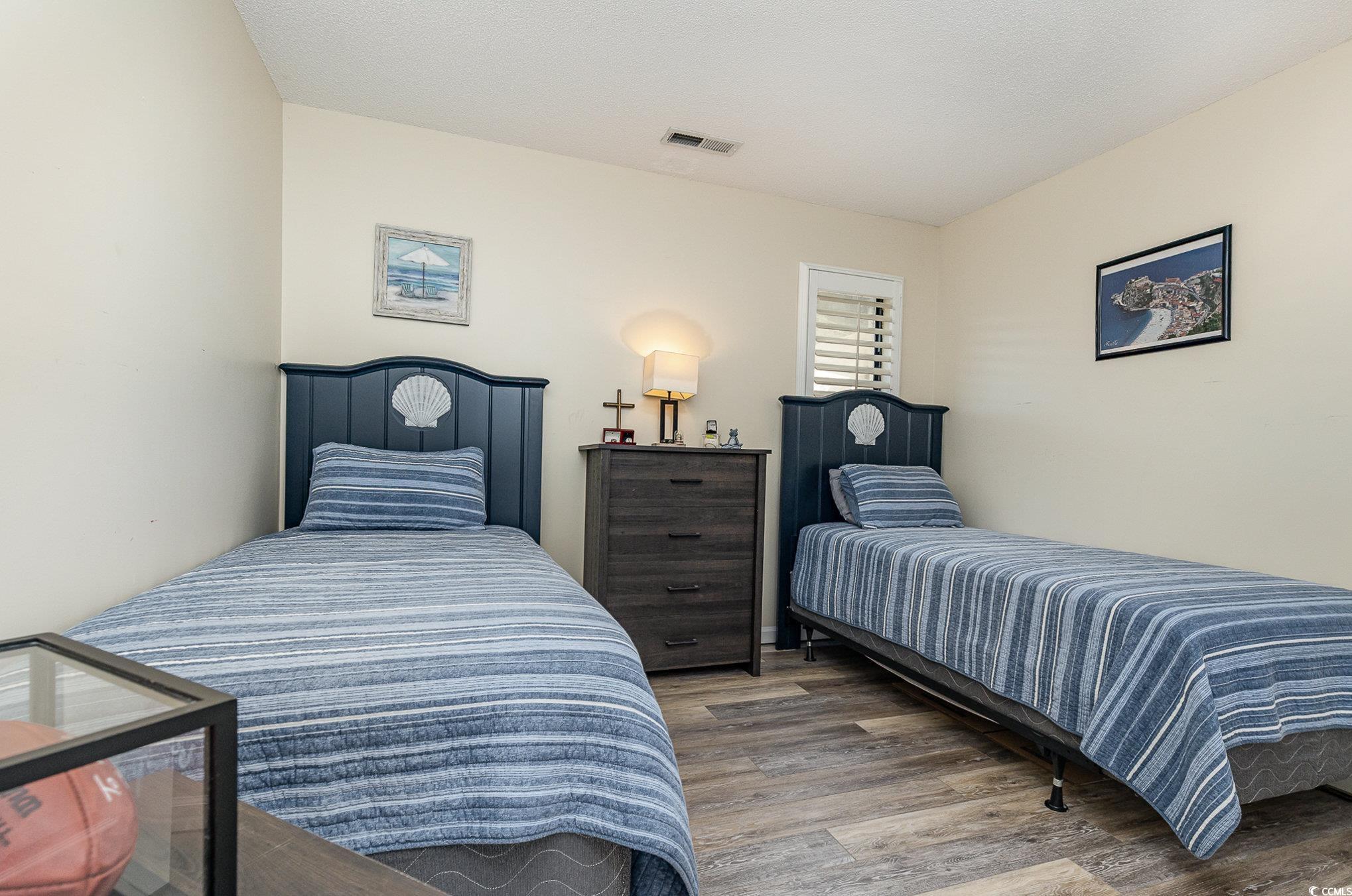 1101 Possum Trot Road, Unit B203 North Myrtle Beach, SC 29582 - Photo 22 of 37 Bedroom with hardwood / wood-style floors