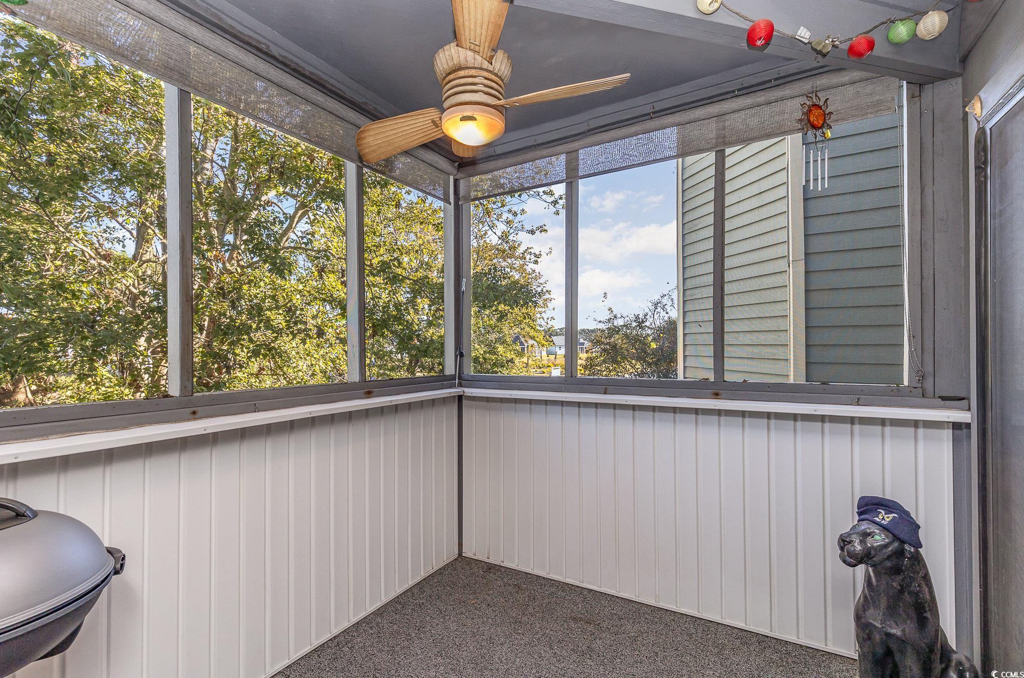 1101 Possum Trot Road, Unit B203 North Myrtle Beach, SC 29582 - Photo 27 of 37 Unfurnished sunroom with ceiling fan
