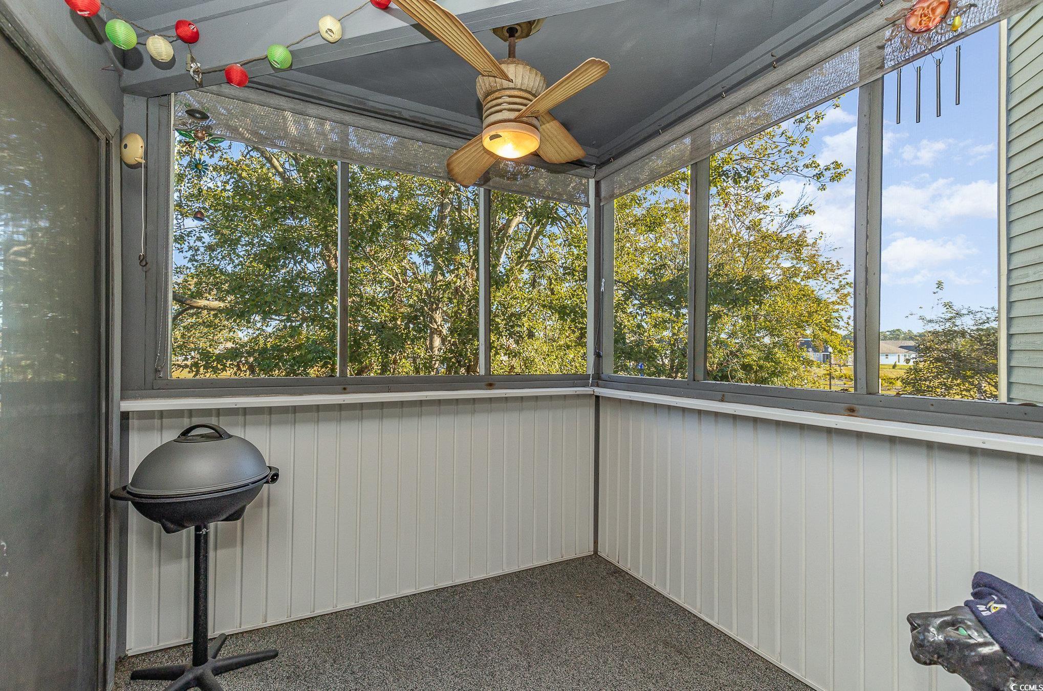 1101 Possum Trot Road, Unit B203 North Myrtle Beach, SC 29582 - Photo 29 of 37 Unfurnished sunroom with ceiling fan and plenty of