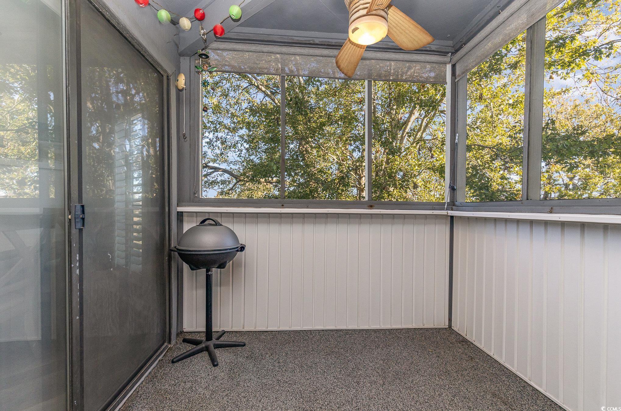 1101 Possum Trot Road, Unit B203 North Myrtle Beach, SC 29582 - Photo 30 of 37 Unfurnished sunroom with ceiling fan