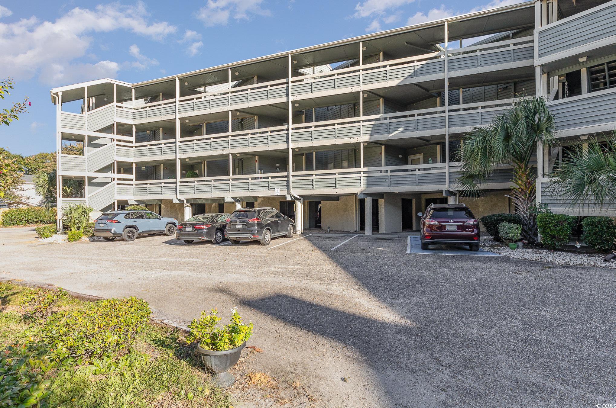 1101 Possum Trot Road, Unit B203 North Myrtle Beach, SC 29582 - Photo 35 of 37 View of property featuring a carport