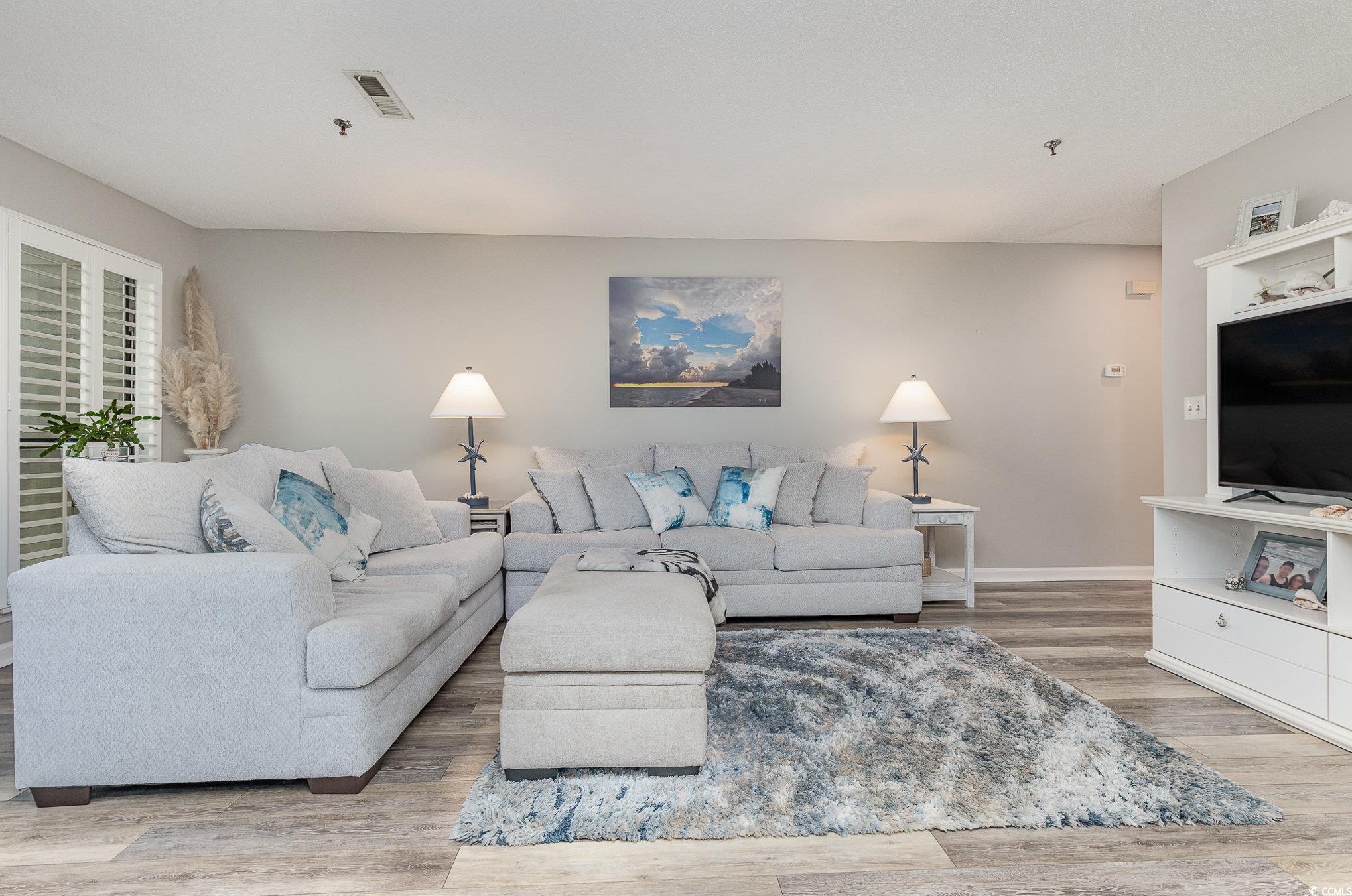 Living room with hardwood / wood-style floors