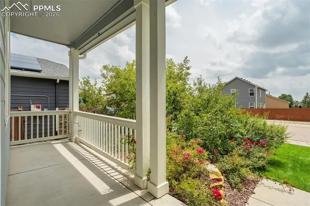 a view of a garden from a porch