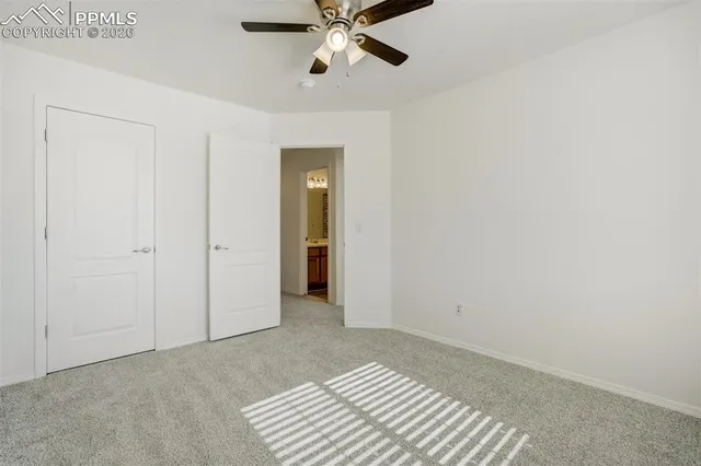 a bedroom with furniture and wooden floor