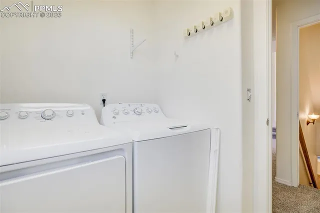 a view of a house with potted plants