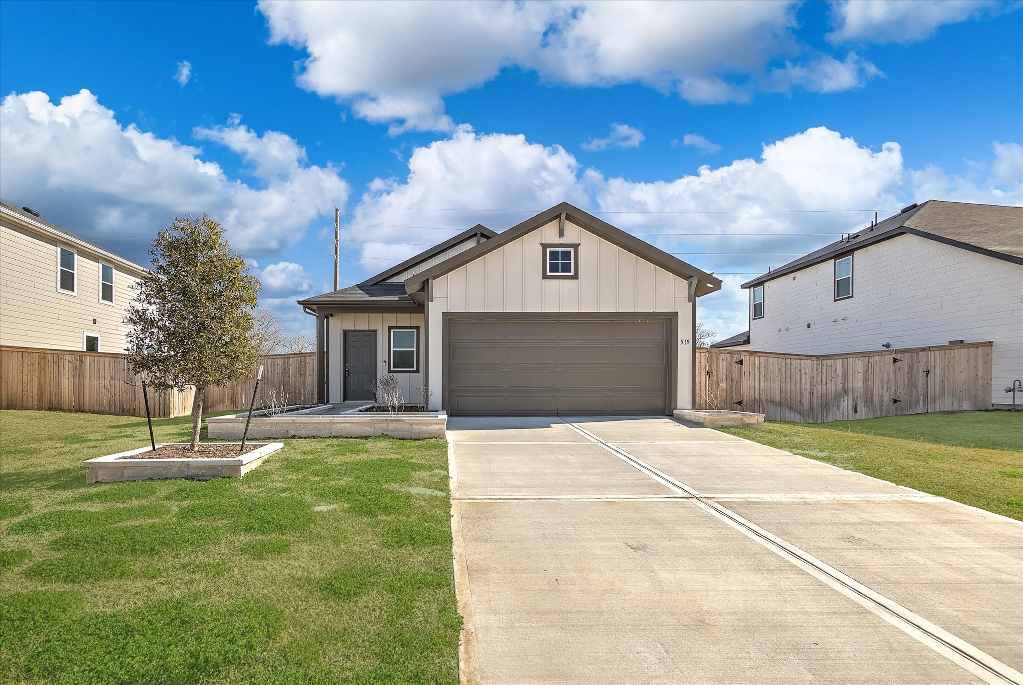 519 Louis Lane Baytown, TX 77523 - Photo 1 of 43 a front view of a house with a yard and garage