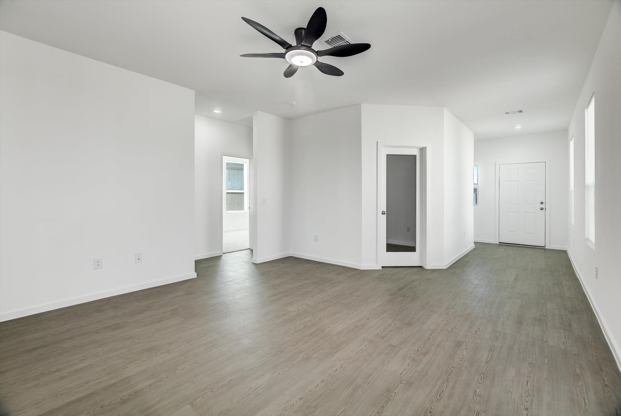 519 Louis Lane Baytown, TX 77523 - Photo 8 of 43 a view of an empty room with a ceiling fan