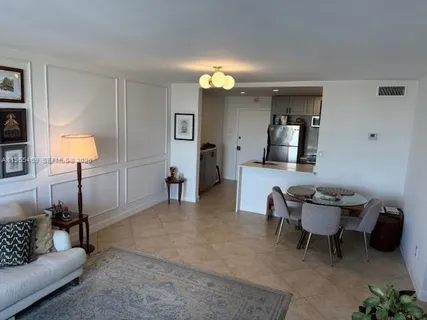 a living room with furniture and a lamp