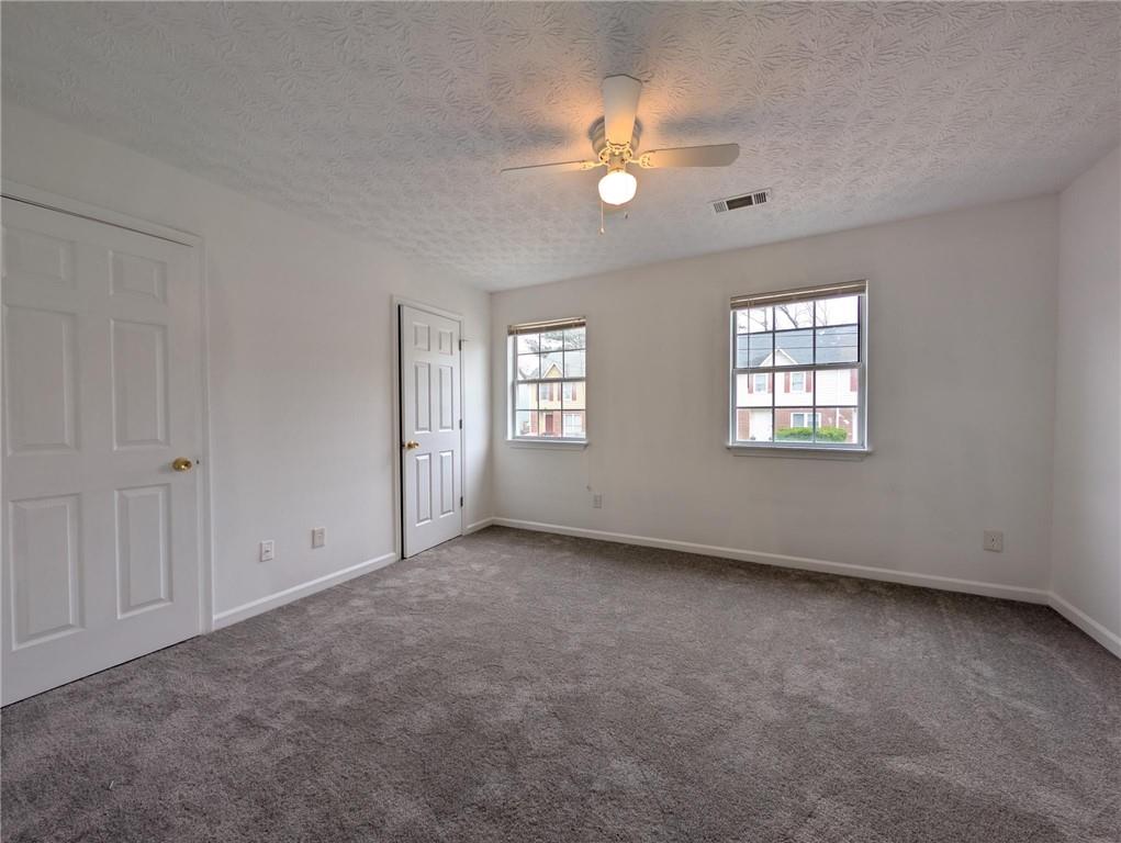 4351 Logan Way Acworth, GA 30101 - Photo 7 of 11 a view of an empty room with windows