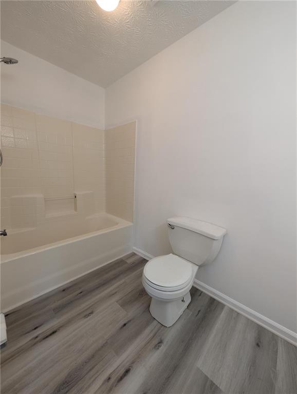 4351 Logan Way Acworth, GA 30101 - Photo 10 of 11 a bathroom with a toilet and a bathtub