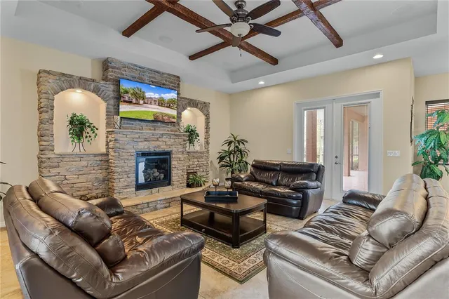 a large kitchen with kitchen island a sink stainless steel appliances and chandelier