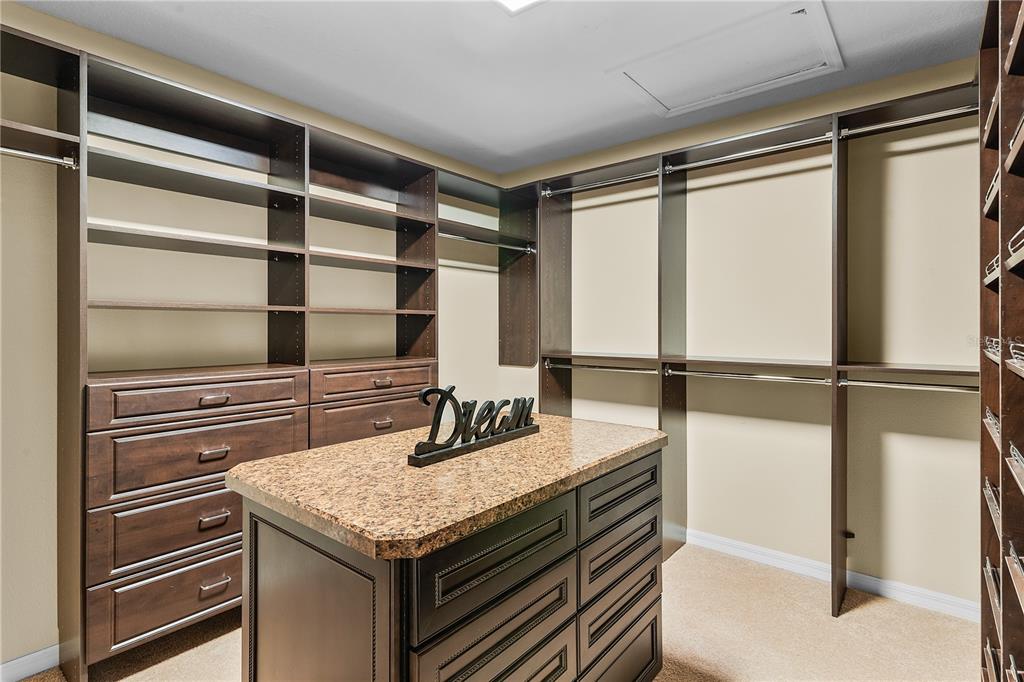 10710 Southwest 49th Avenue Ocala, FL 34476 - Photo 20 of 48 a kitchen with a refrigerator a sink and cabinets