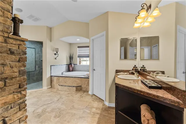 a kitchen with stainless steel appliances granite countertop a stove and a sink