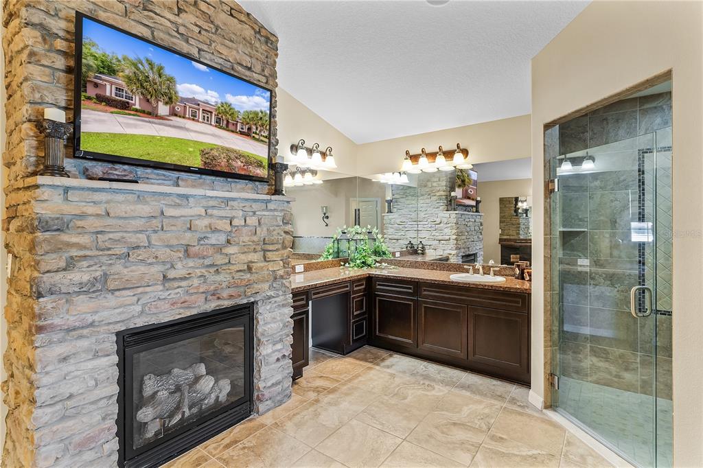10710 Southwest 49th Avenue Ocala, FL 34476 - Photo 26 of 48 a kitchen with stainless steel appliances granite countertop a stove and a sink