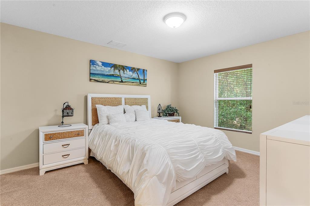 10710 Southwest 49th Avenue Ocala, FL 34476 - Photo 35 of 48 a bedroom with a bed and a window