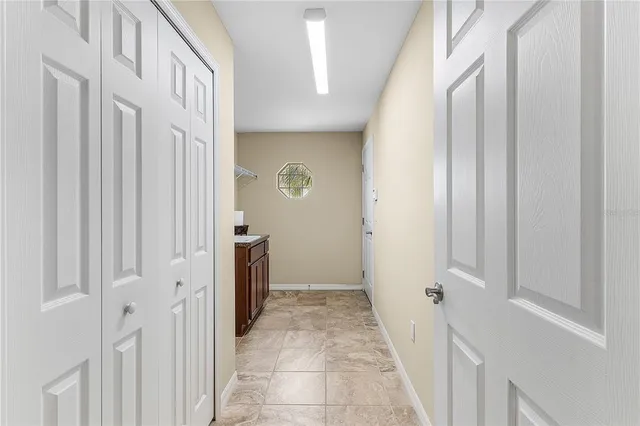 a bathroom with a window and a shower