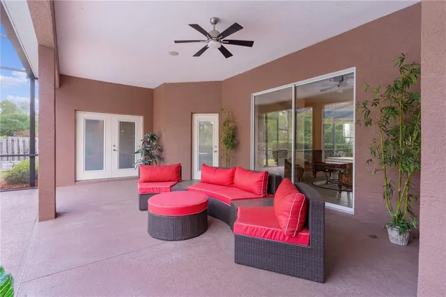 a view of a house with a big yard and potted plants