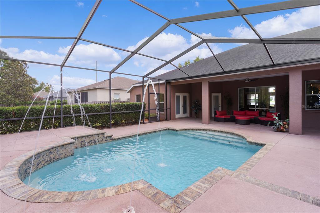 10710 Southwest 49th Avenue Ocala, FL 34476 - Photo 7 of 48 a view of a swimming pool with seating area