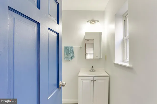 a bathroom with a sink and mirror