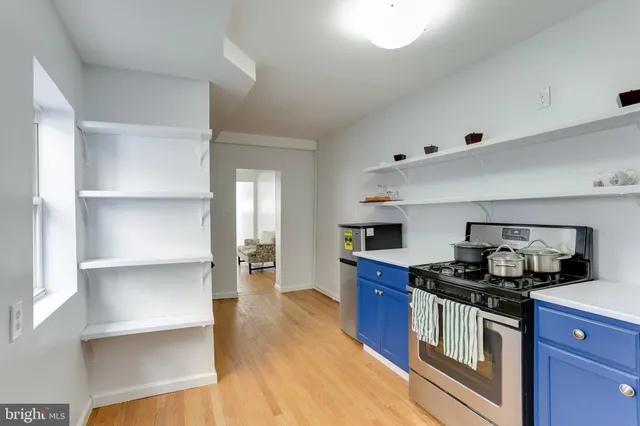 a kitchen with a stove and a refrigerator