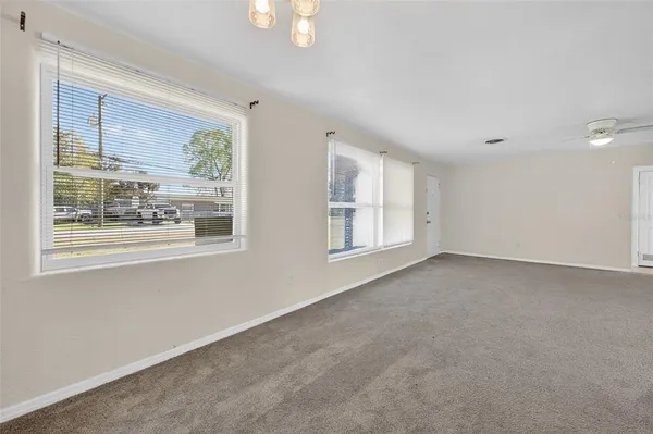 a view of an empty room with a window