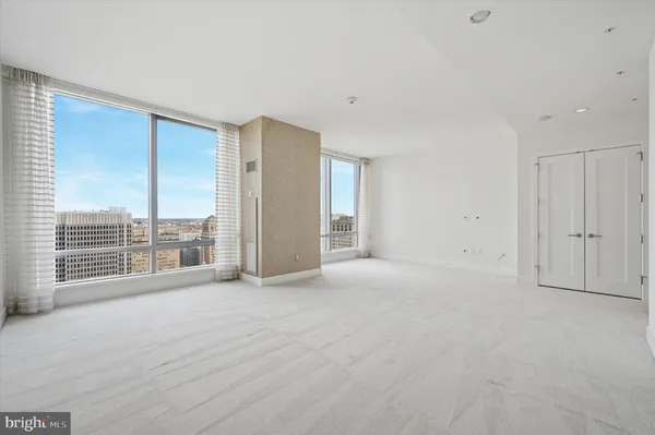 a view of an empty room with a balcony