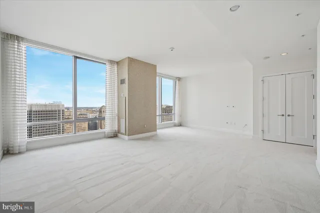 a view of an empty room with a balcony
