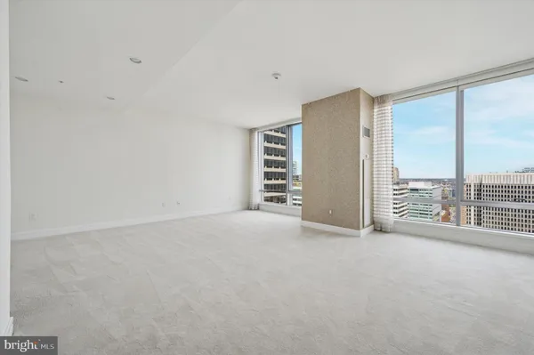 a view of an empty room with a balcony