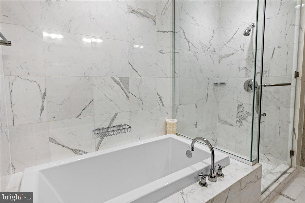 1414 South Penn Square, Unit 26CDE Philadelphia, PA 19102 - Photo 23 of 53 a bathroom with a bathtub and a shower