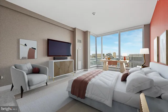 a bedroom with a bed and glass window