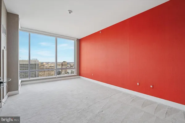 a view of an empty room with a balcony