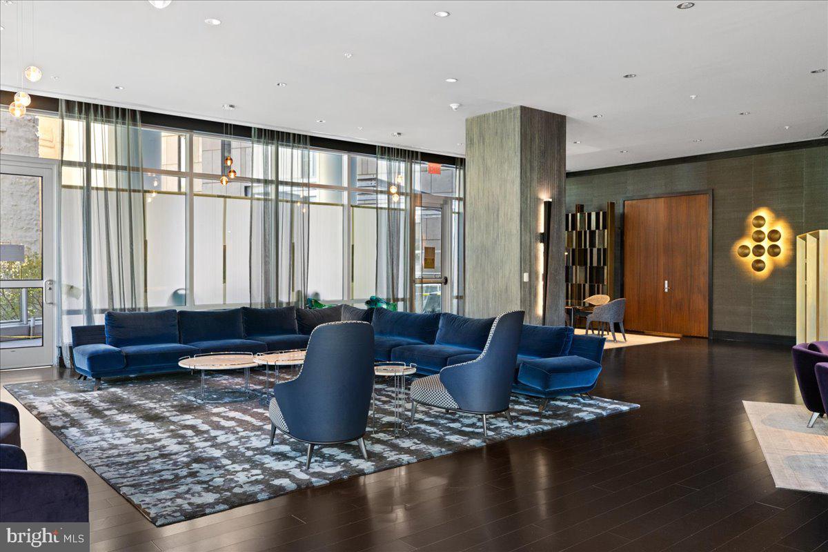 1414 South Penn Square, Unit 26CDE Philadelphia, PA 19102 - Photo 31 of 53 a living room with furniture and a potted plant