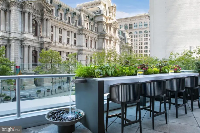 a view of a chair and table in the balcony
