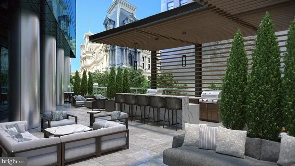 a balcony with furniture and a potted plant