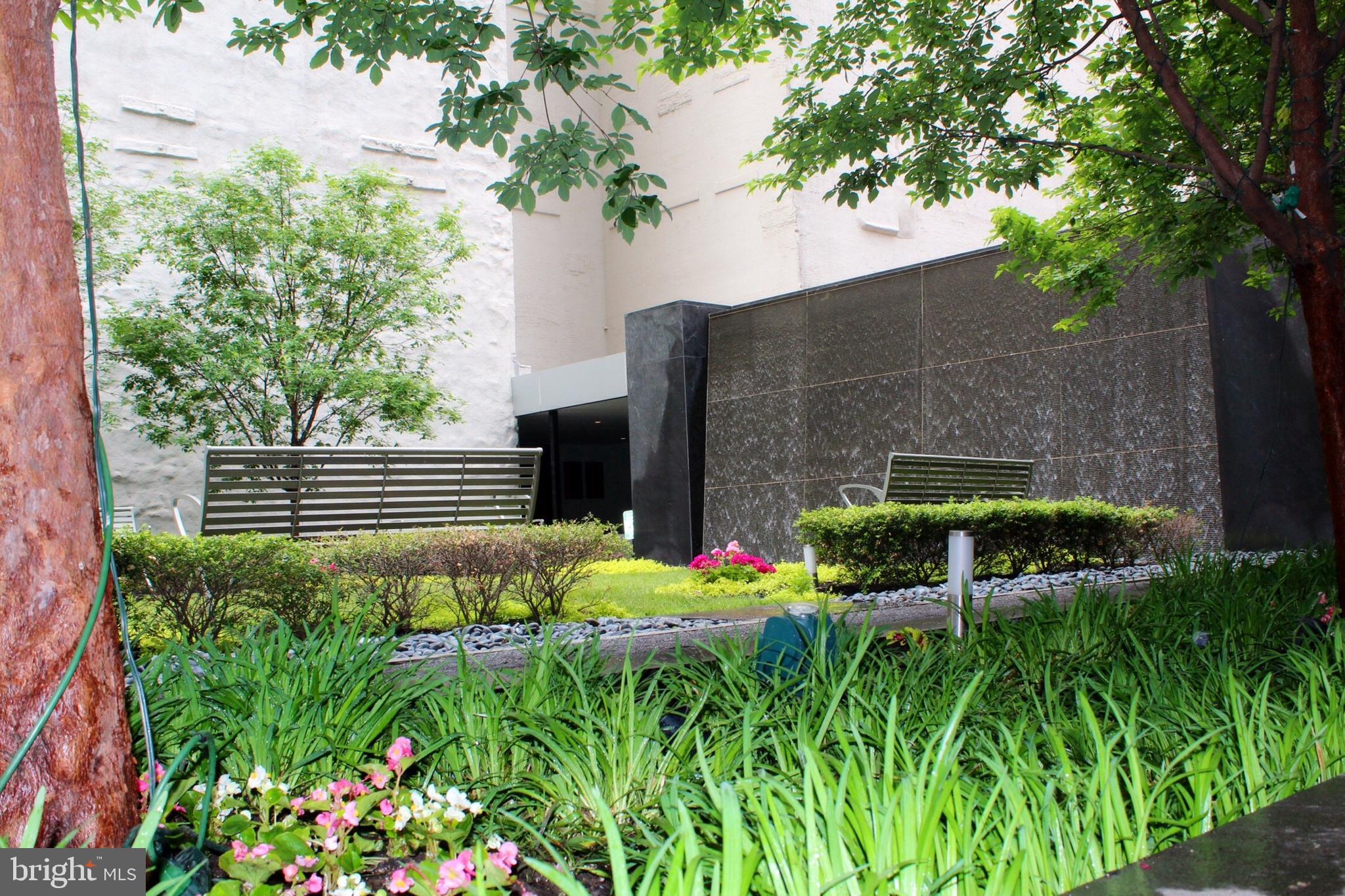1414 South Penn Square, Unit 26CDE Philadelphia, PA 19102 - Photo 40 of 53 a backyard of a house with lots of green space
