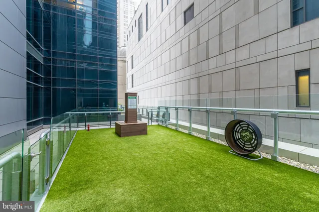 a view of yard with swimming pool and furniture