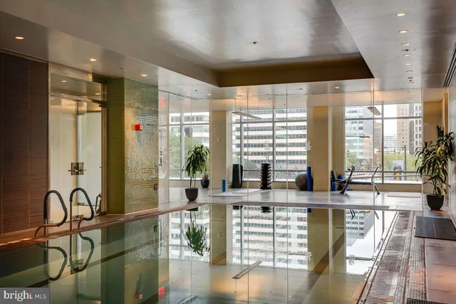 a bathroom with a tub and shower