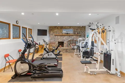 a view of a room with gym equipment