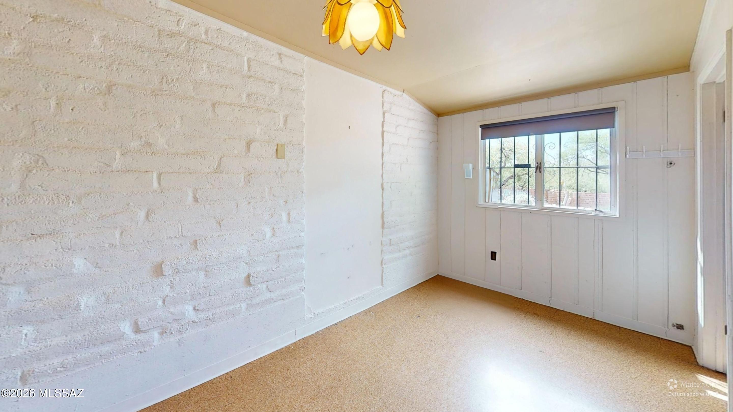 4130 East River Road Tucson, AZ 85718 - Photo 22 of 46 a view of an empty room with a window