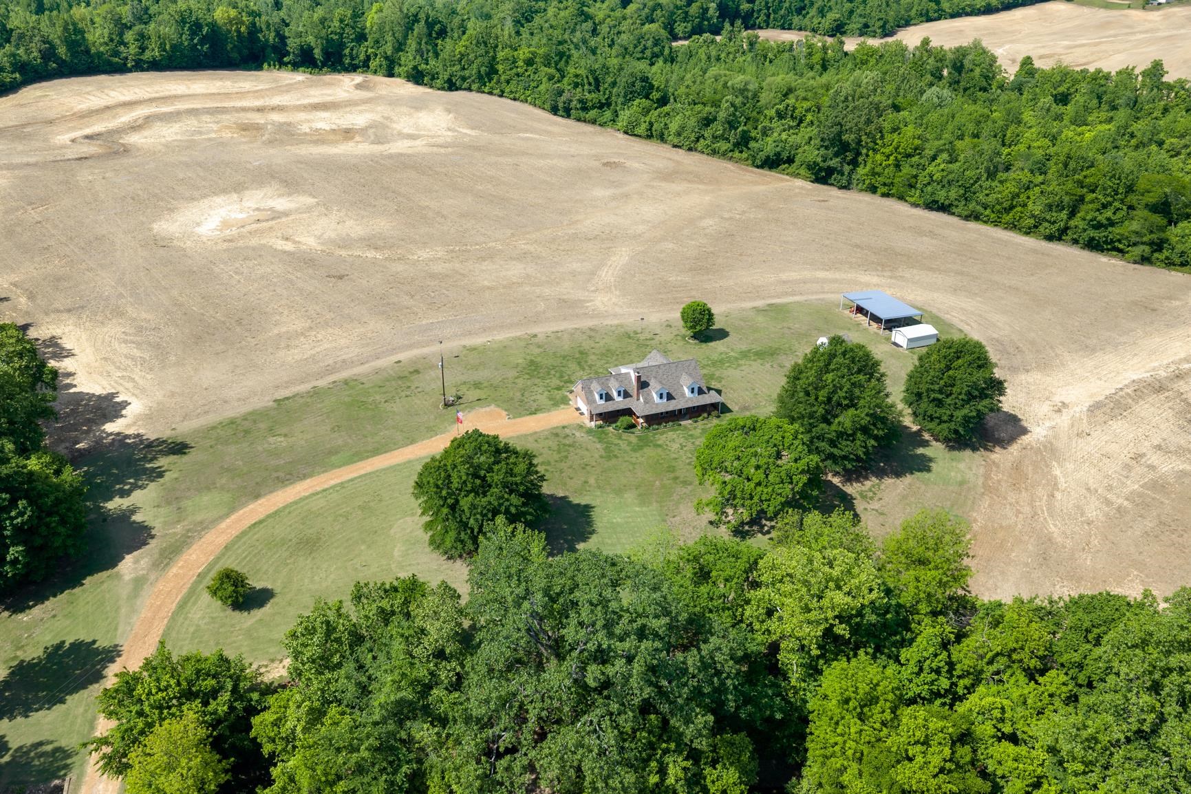 8539 Campground Road Drummonds, TN 38023 - Photo 38 of 38 an aerial view of a house with a yard