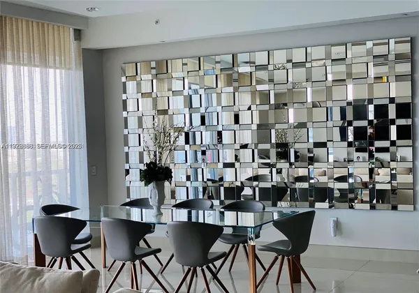 a dining room with a table and chairs