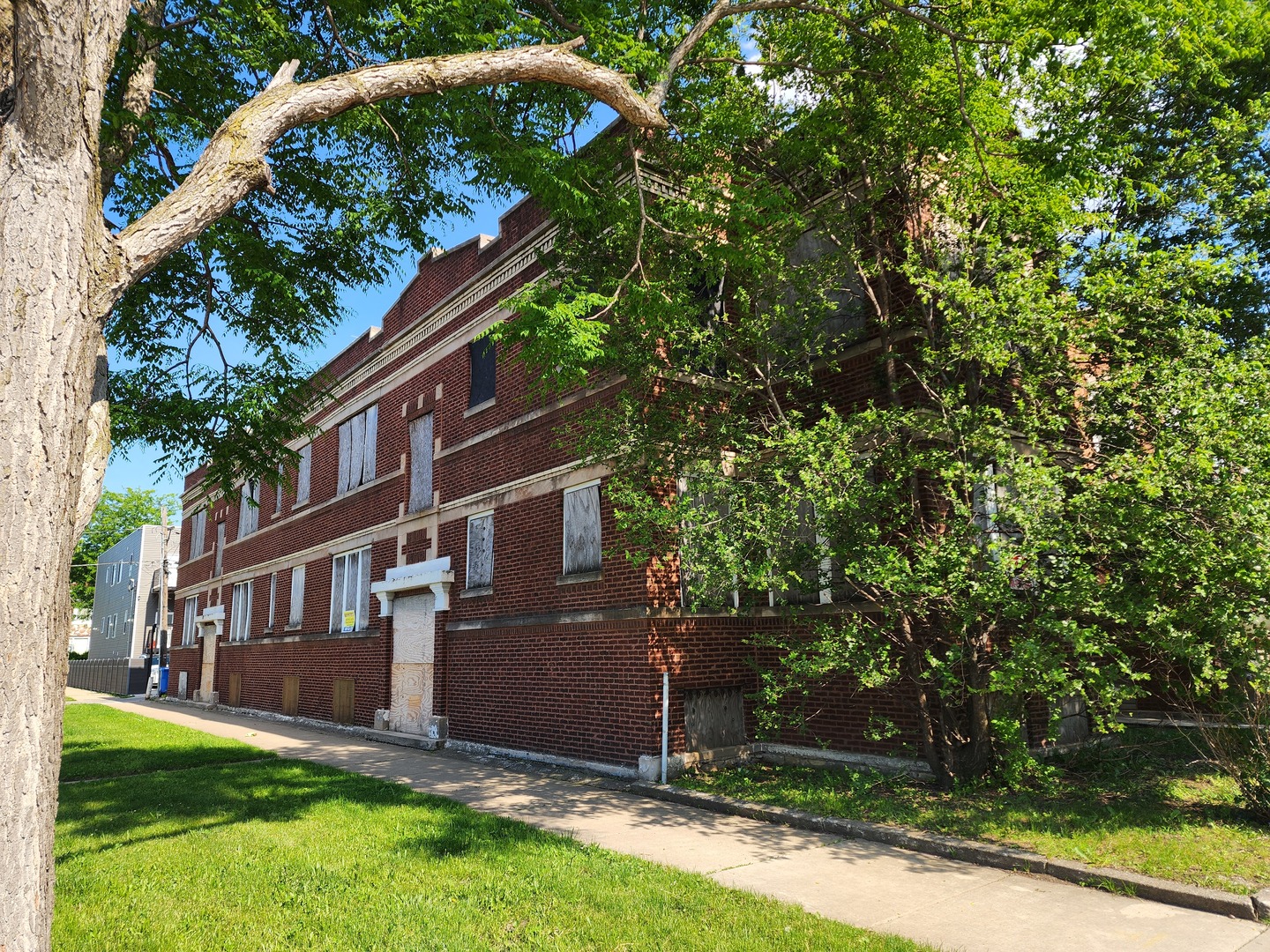 4921 West Maypole Avenue Chicago, IL 60644 - Photo 2 of 3 a front view of a house with a garden