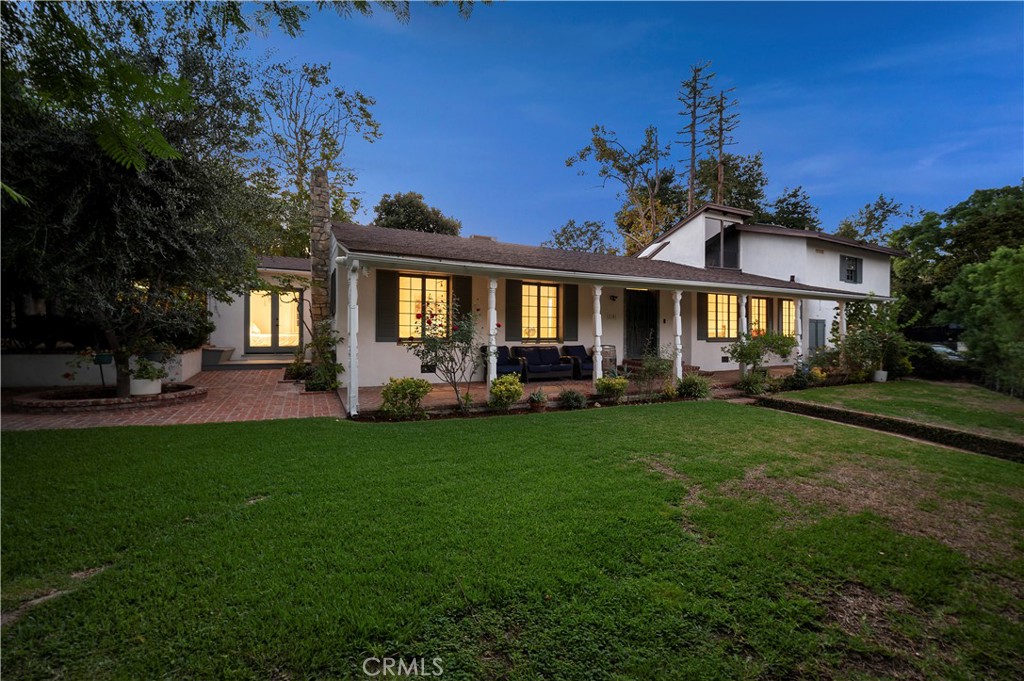 11305 Valley Spring Lane Studio City, CA 91602 - Photo 11 of 50 a front view of a house with a garden
