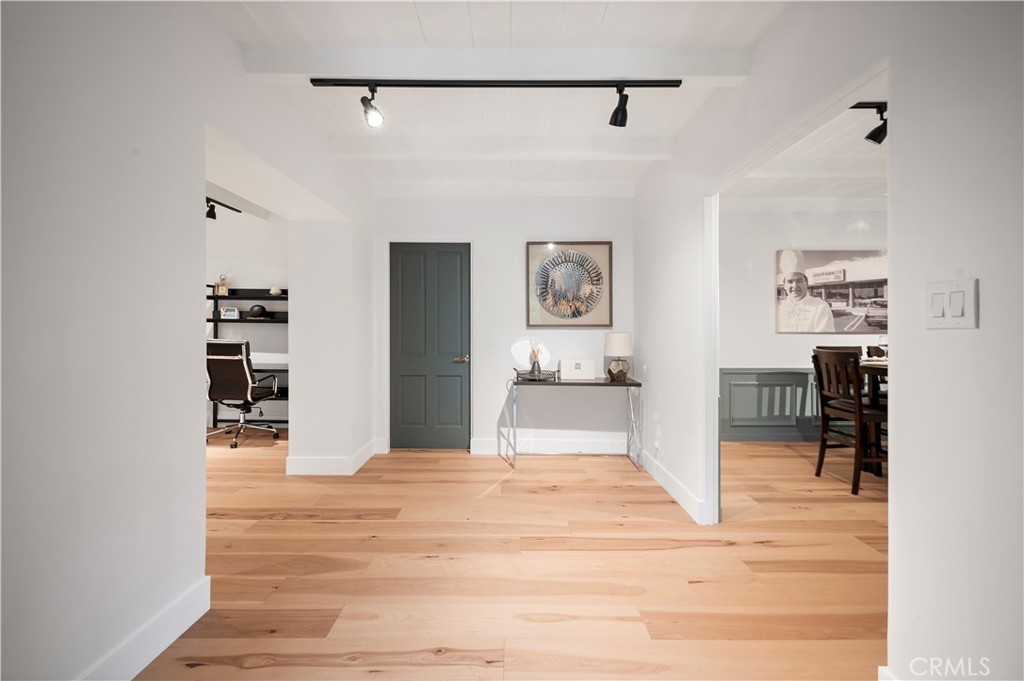 11305 Valley Spring Lane Studio City, CA 91602 - Photo 13 of 50 a view of a hallway view with wooden floor and furniture