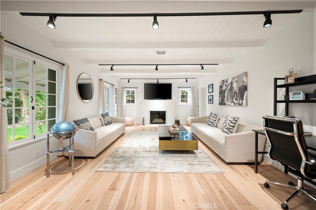 11305 Valley Spring Lane Studio City, CA 91602 - Photo 18 of 50 a living room with furniture and a fireplace