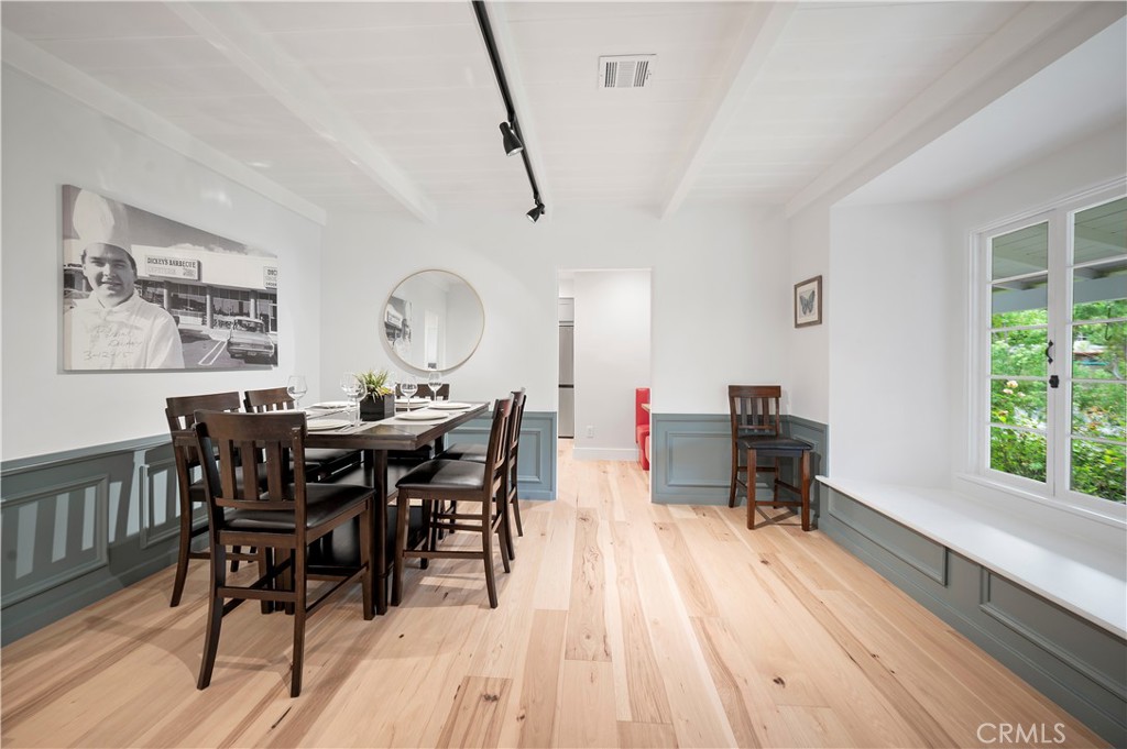 11305 Valley Spring Lane Studio City, CA 91602 - Photo 25 of 50 a view of a dining room with furniture and wooden floor