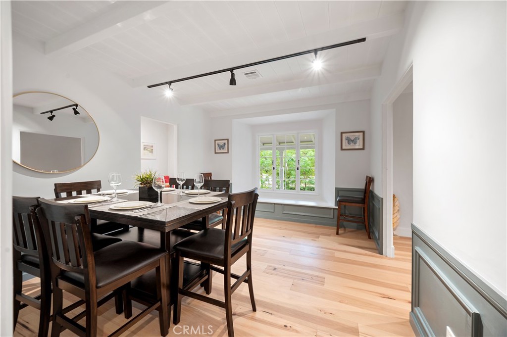 11305 Valley Spring Lane Studio City, CA 91602 - Photo 26 of 50 a view of a dining room with furniture and a window