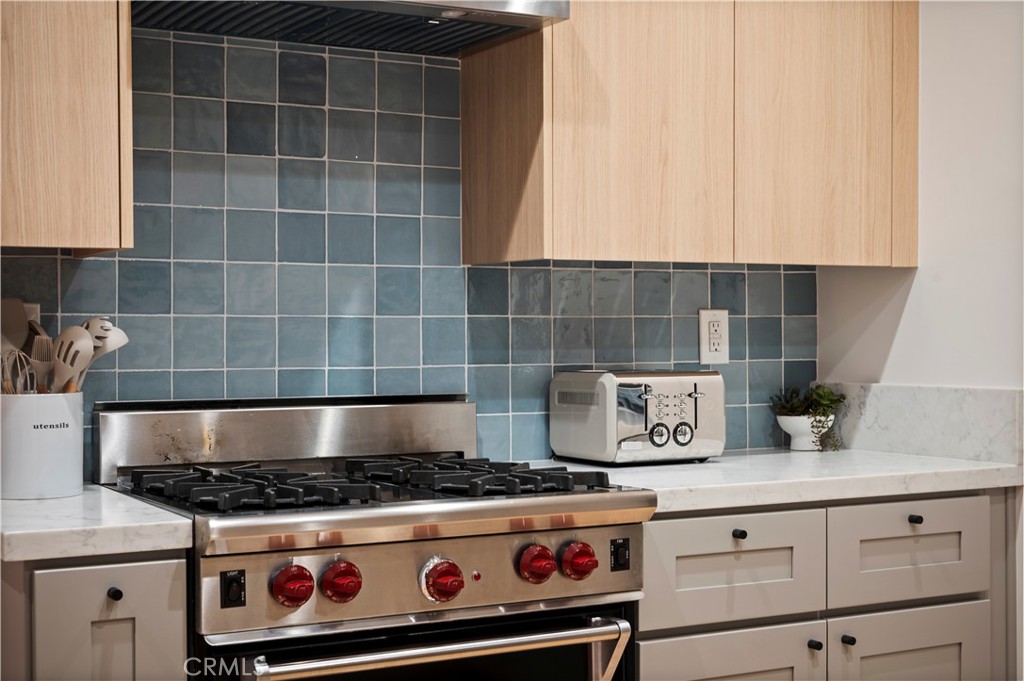 11305 Valley Spring Lane Studio City, CA 91602 - Photo 28 of 50 a stove top oven sitting inside of a kitchen