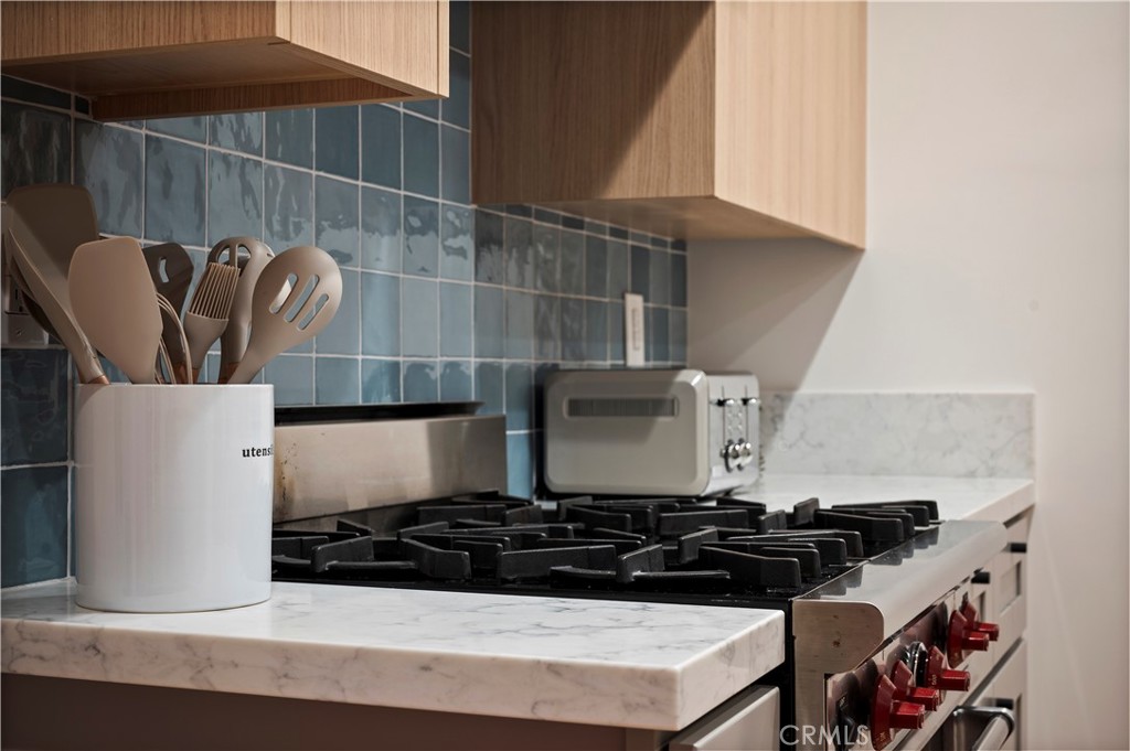 11305 Valley Spring Lane Studio City, CA 91602 - Photo 34 of 50 a close view of a stove and a microwave oven