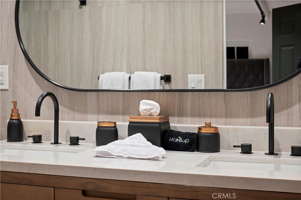 11305 Valley Spring Lane Studio City, CA 91602 - Photo 38 of 50 a kitchen with a sink and a stove with wooden floor